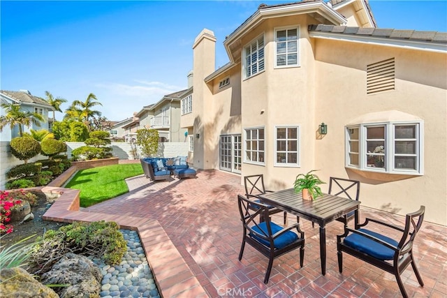 view of patio / terrace featuring fence