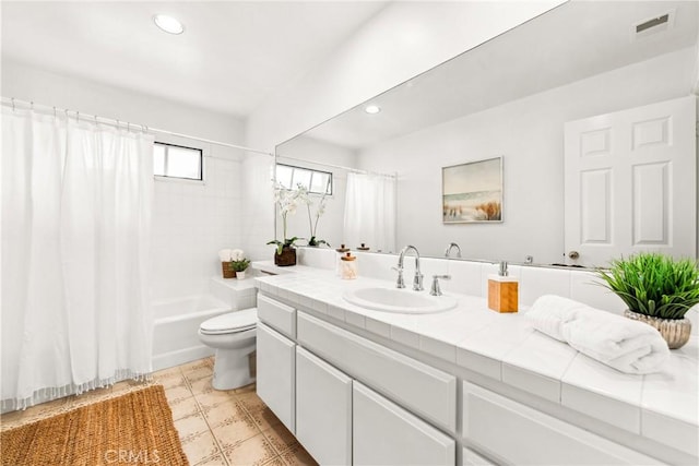 bathroom featuring toilet, recessed lighting, vanity, visible vents, and shower / bath combination with curtain