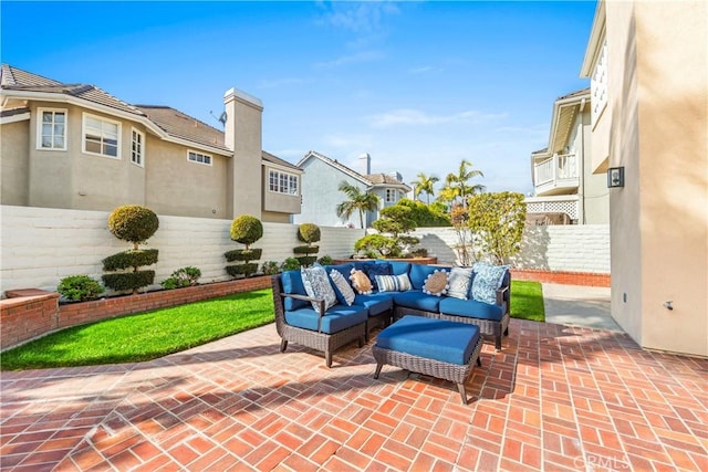 view of patio / terrace featuring a residential view, a fenced backyard, and outdoor lounge area