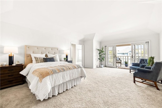 bedroom featuring access to exterior and light colored carpet