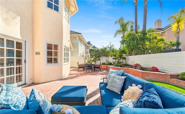 view of patio / terrace featuring outdoor dining area, a fenced backyard, and an outdoor hangout area