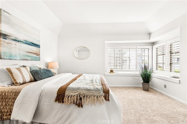 carpeted bedroom featuring baseboards