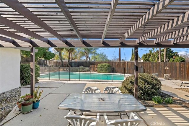 view of swimming pool with a pergola and a patio