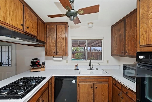 kitchen featuring sink, ceiling fan, and black appliances