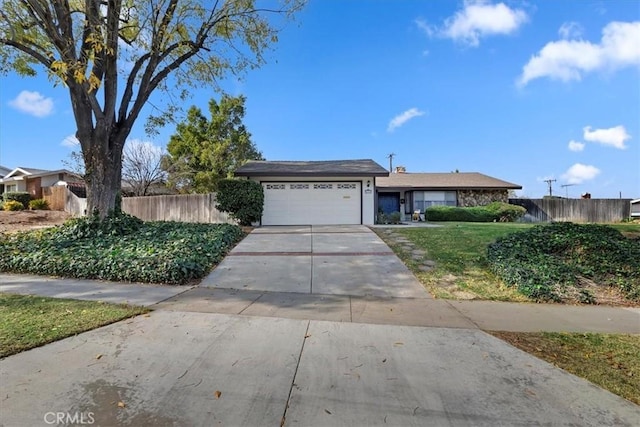 ranch-style house featuring a garage