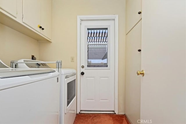 washroom featuring cabinets, carpet, and washer and dryer