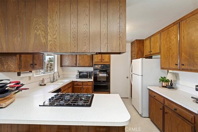 kitchen featuring sink and black appliances