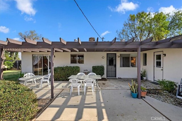 back of house featuring a pergola and a patio area