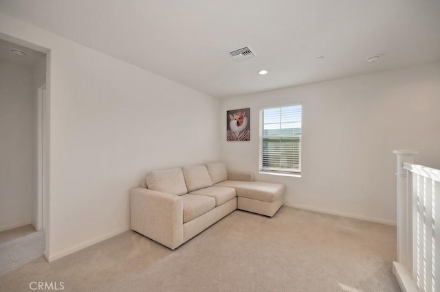 living room featuring light carpet