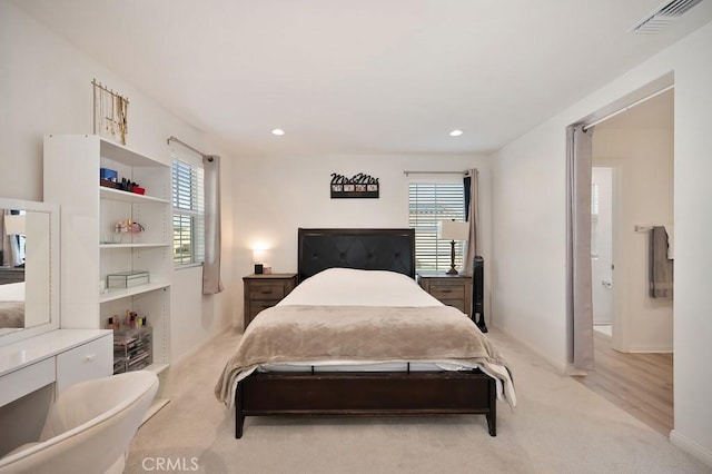 bedroom with light colored carpet