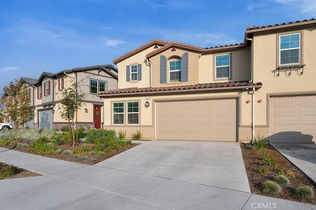 mediterranean / spanish-style house featuring a garage