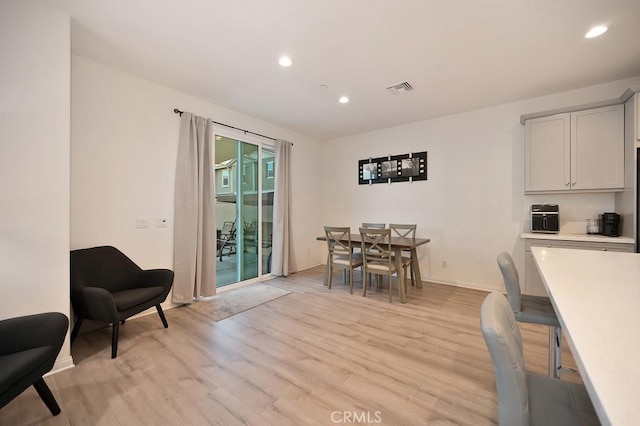 dining area with light wood-type flooring