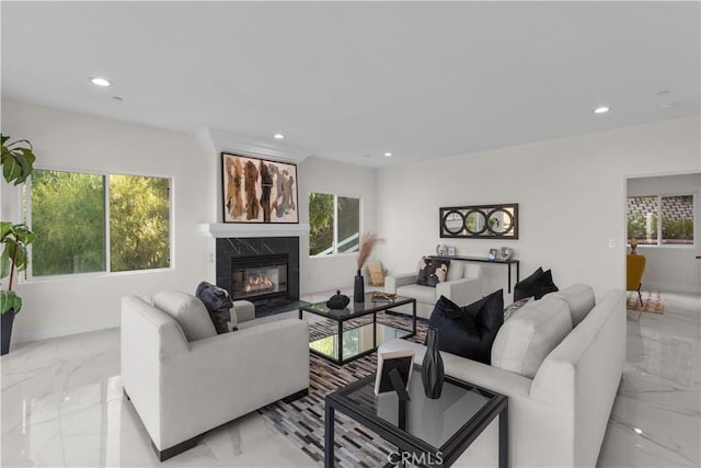 living room featuring a healthy amount of sunlight and a fireplace