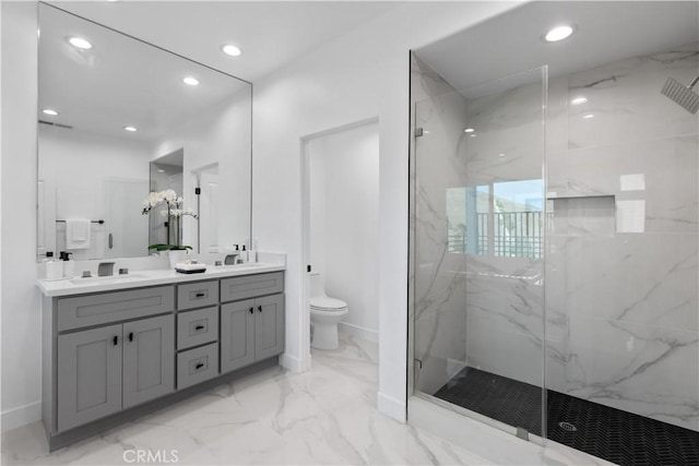 bathroom featuring walk in shower, vanity, and toilet