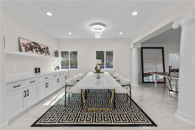 dining space with ornate columns