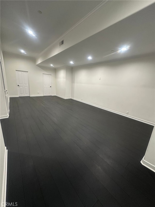 spare room with dark hardwood / wood-style flooring