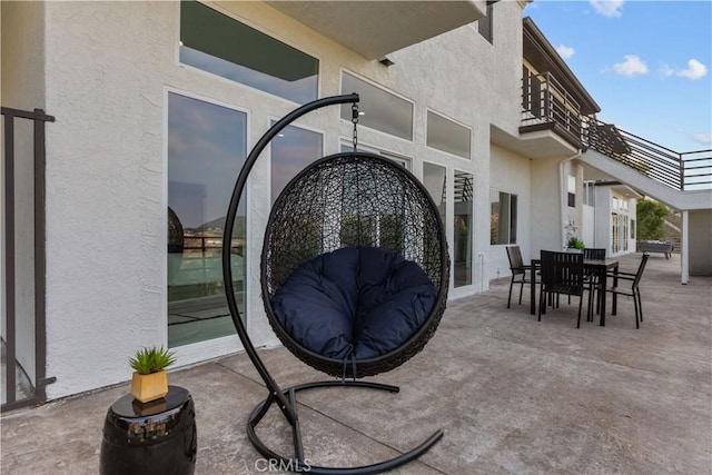 view of patio with a balcony