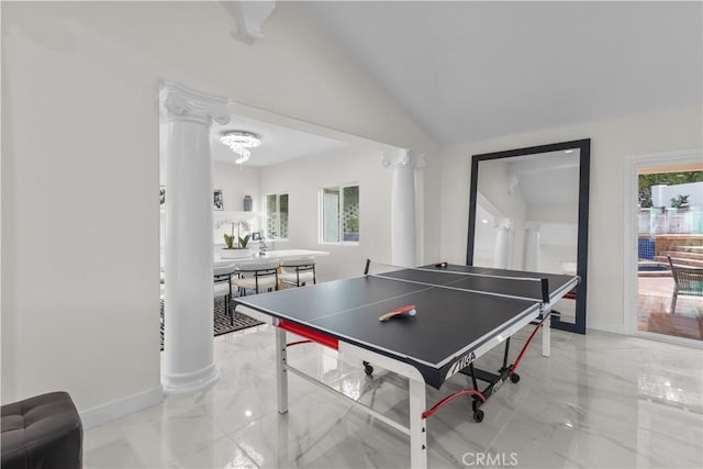 playroom with ornate columns and vaulted ceiling