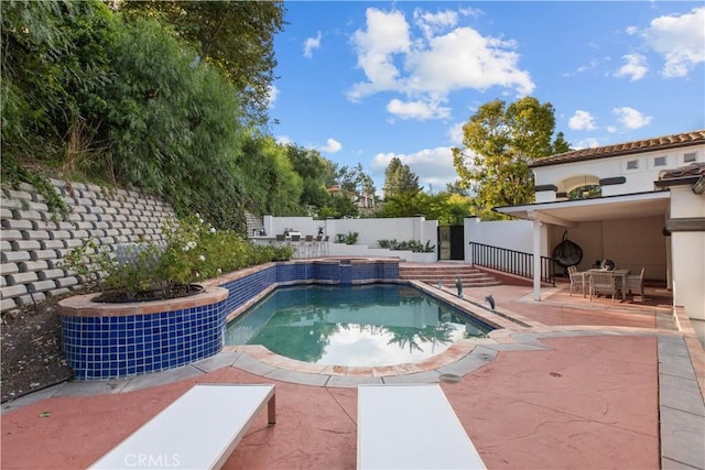 view of pool featuring a patio area and central air condition unit