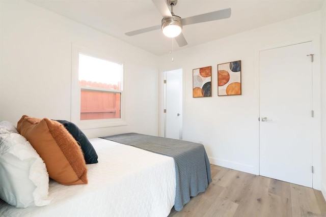 bedroom featuring ceiling fan and light hardwood / wood-style flooring