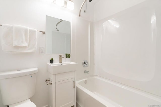 full bathroom featuring vanity, bathtub / shower combination, and toilet