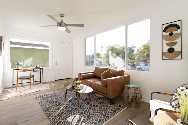 sitting room featuring ceiling fan and light hardwood / wood-style flooring