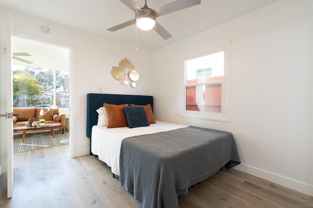 bedroom featuring hardwood / wood-style floors and ceiling fan