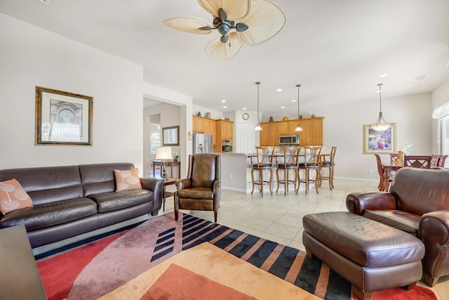 living room featuring light tile patterned flooring and ceiling fan