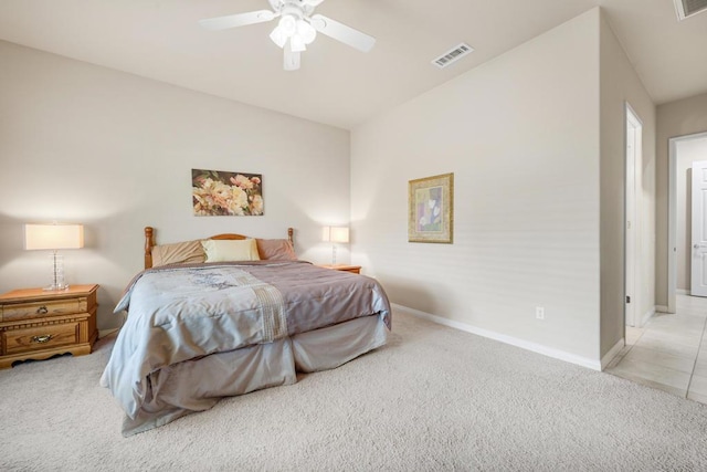 bedroom featuring ceiling fan and light carpet