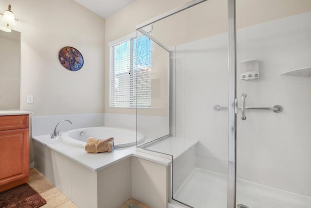 bathroom featuring vanity, separate shower and tub, and tile patterned floors