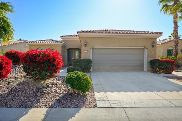 mediterranean / spanish house featuring a garage