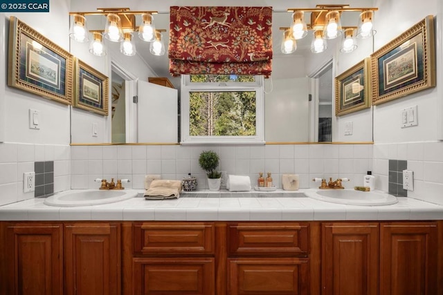 bathroom with vanity and backsplash