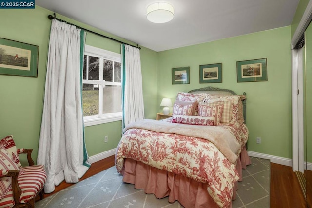 bedroom with wood-type flooring