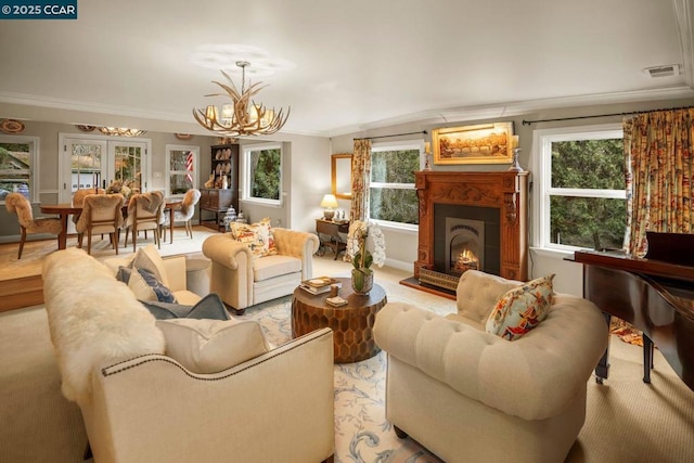 living room featuring ornamental molding and a notable chandelier