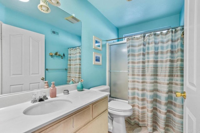 full bathroom featuring vanity, shower / bath combination with curtain, and toilet