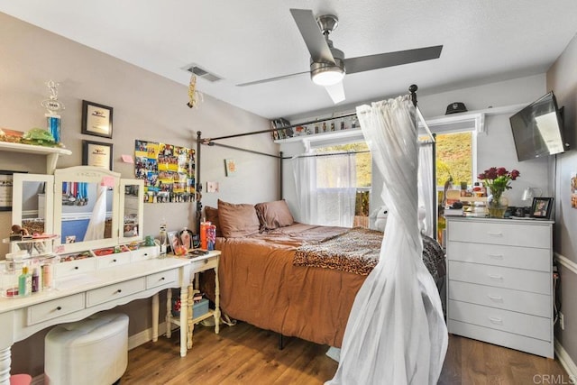 bedroom featuring dark hardwood / wood-style floors and ceiling fan