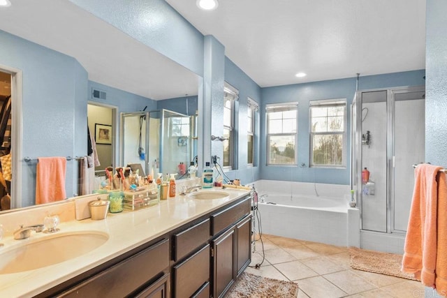 bathroom with vanity, shower with separate bathtub, and tile patterned flooring