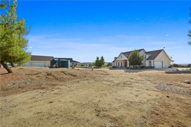 view of yard with a garage