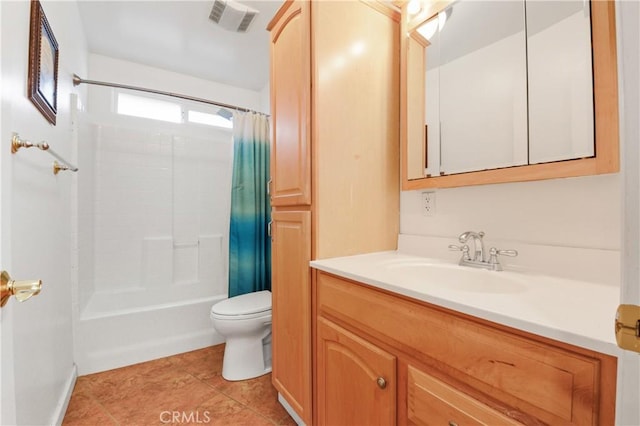 full bathroom featuring vanity, tile patterned flooring, toilet, and shower / bath combo with shower curtain