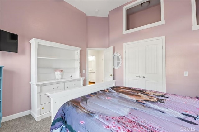 carpeted bedroom featuring a closet