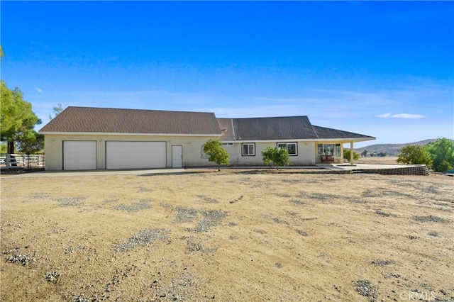 ranch-style house featuring a garage