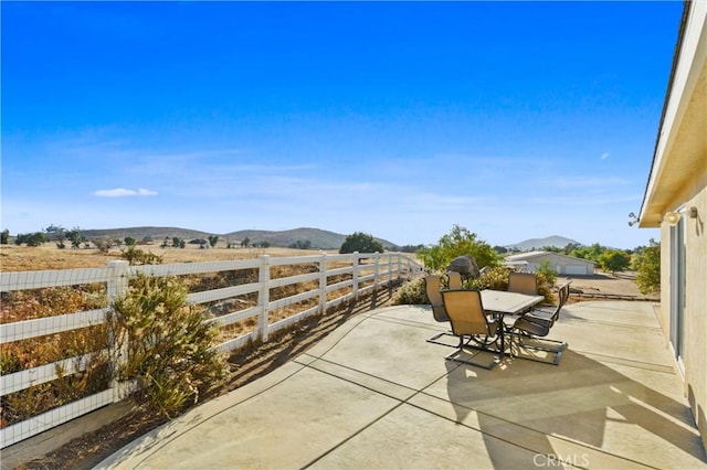 view of patio / terrace featuring a mountain view