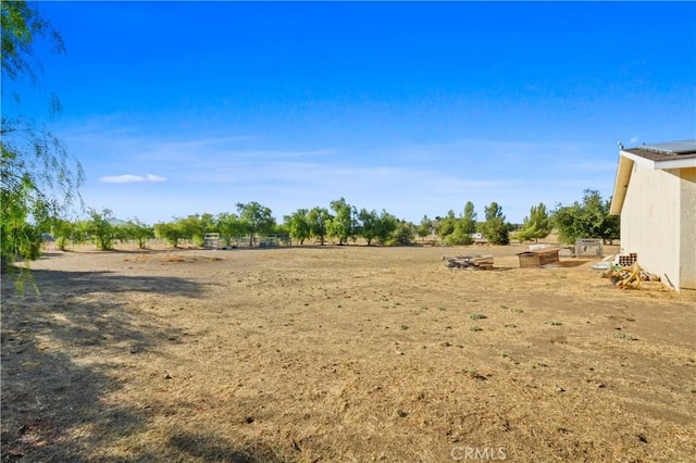 view of yard with a rural view