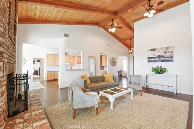 living room with wood ceiling, ceiling fan, beam ceiling, a fireplace, and dark hardwood / wood-style flooring