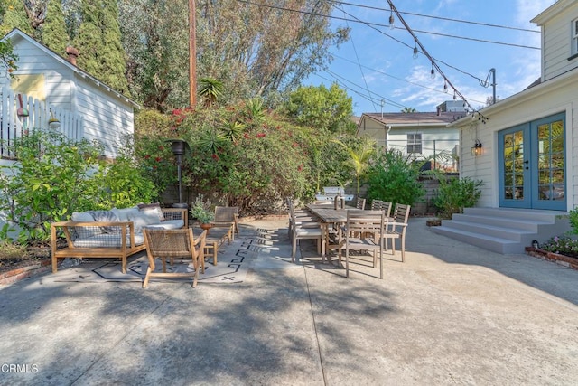 view of patio with an outdoor living space and french doors