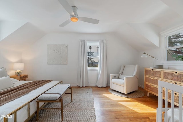 bedroom featuring vaulted ceiling, ceiling fan, and light hardwood / wood-style floors