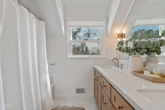 bathroom with vanity and curtained shower