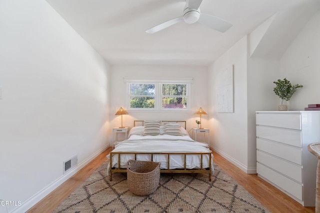 bedroom with ceiling fan and light hardwood / wood-style floors