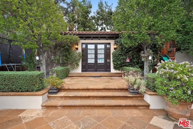 property entrance featuring french doors