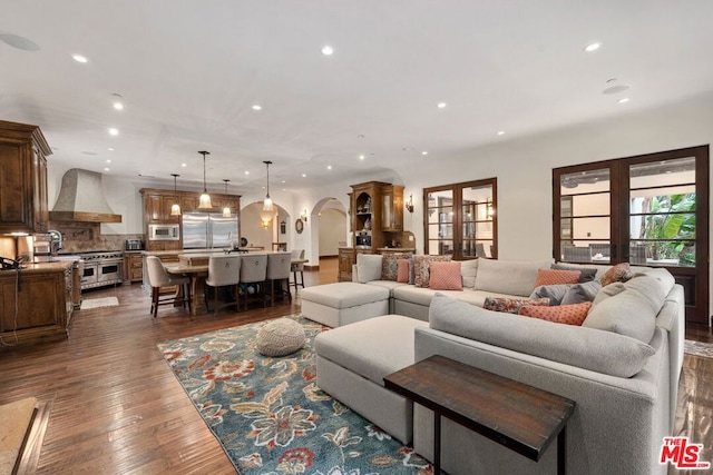 living room featuring dark hardwood / wood-style floors and french doors